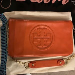 Tory Burch orange Clutch.